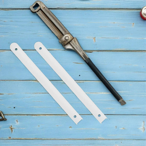 Three Pack Plastic Drawer Slides for Cabinets and Cupboards on a blue wooden background