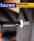 Close-up of a white head wood screw being driven into wood, showcasing the Etauwe high-quality design.