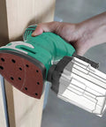 Green mouse sander with 120 Piece Sanding Sheets For Mouse Sander With 11 Hole Dust Removal Mixed Grits 40 60 80 120 180 240 attached
