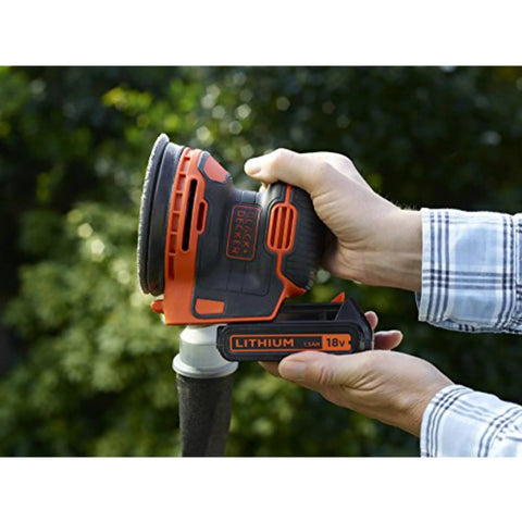 Badass 18V Cordless Orbital Sander With Killer Dust Control And Super Smooth Softgrip Handle For Hassle Free Wood Projects 12,000 Opms Compact Orange Design shown in hand with battery pack.