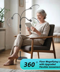 Woman reading with 10X Floor Magnifying Glass With Light And Stand, 5.1 Inch Real Glass Lens, 360 Degree Gooseneck in living room