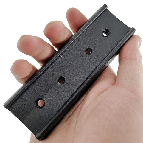 Hand holding 120mm 4.7in Rail Bar Kit for Vixen Style Plate to Couple Telescope Tubes to Mount, heavy-duty black aluminum rail