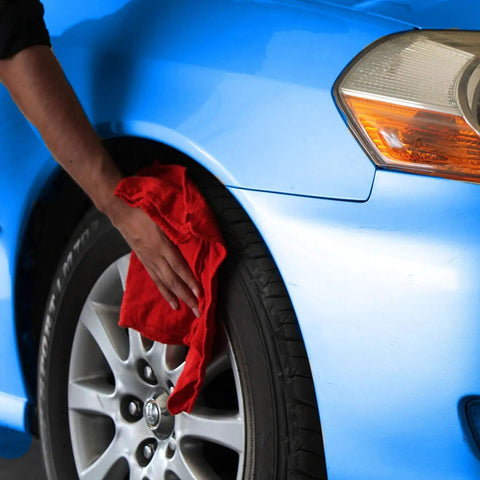 Person using Red Cotton Shop Towels 145 Pack Commercial Grade 14 By 12 Inches Reusable Cleaning Rags on car tire