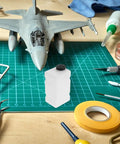 Clear 120CC RC Plane Fuel Tank Set With Metal Tubing And Engine Container on a hobby table with model aircraft