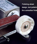 Polishing wheel and sanding belt on the Badass Electric Knife Sharpener And Wet Bench Sander for smooth tool finishing.