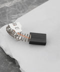 Heavy Duty 4 Piece Carbon Motor Brushes Replacement 326795 Compatible With Hilti TE 7C showing single brush on marble