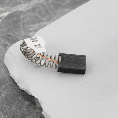 Heavy Duty 4 Piece Carbon Motor Brushes Replacement 326795 Compatible With Hilti TE 7C showing single brush on marble