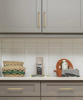 Gold Crystal Drawer Pulls 4 Pack installed on gray kitchen cabinets, showcasing luxurious crystal accents and zinc alloy farmhouse hardware.