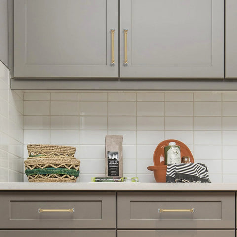 Gold Crystal Drawer Pulls 4 Pack installed on gray kitchen cabinets, showcasing luxurious crystal accents and zinc alloy farmhouse hardware.