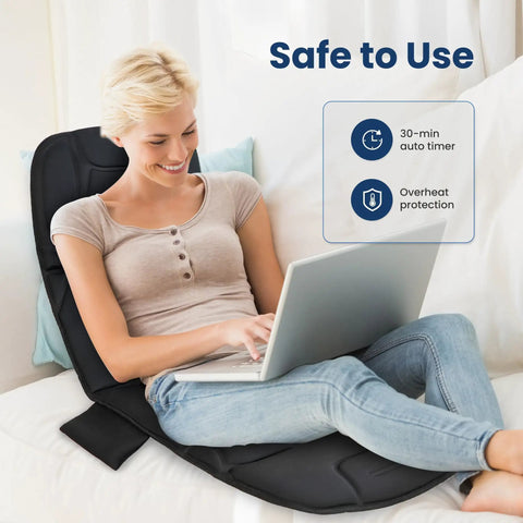 Woman using a Full Body Massage Mat With Heat And Vibration Ten Motors Four Heating Zones 30 Minute Auto Shut Off Foldable Relaxation Pad