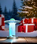 UFO Cow Abduction LED Lamp With Touch Sensor Funny Alien Desk Light on wooden table with snow and gifts background