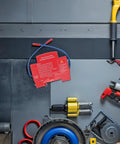 Slick Automatic Aerosol Fire Extinguisher With Smart Sensor Detection on workbench with tools and equipment.