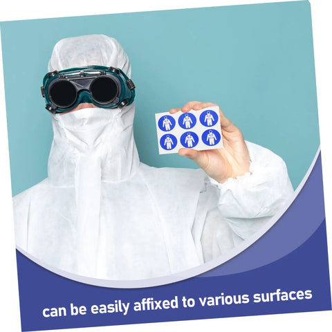 Individual in protective suit holding Ten Pack Protection Suit Warning Labels and Adhesive Safety Stickers for Factory Equipment.