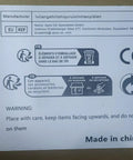 Product label with manufacturer information, warning symbols, EU representative details, and "Made in China" text.