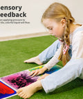 Child interacting with Liquid Sensory Floor Tiles Set 11.8 Inch Square Multicolor For Kids Interactive Sensory Play With Floating Objects.