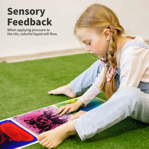 Child interacting with Liquid Sensory Floor Tiles Set 11.8 Inch Square Multicolor For Kids Interactive Sensory Play With Floating Objects.