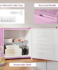 Slick 1.1 Cu Ft Compact Countertop Upright Freezer Featuring Smooth Temperature Dial And Handy Removable Shelf In Vibrant Pink interior with ice shovel, cube tray, and removable shelf.