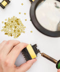 150 Pieces Gold Plated Copper Solder Chips For Jewelry Making And Electronics Repair with hands using soldering iron