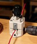 Manual Wire Stripping Machine For Scrap Copper in use with drill attachment on wooden table