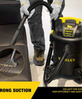 Person using Beast Mode Wet Dry Vacuum With 6 Gallon Tank And 4 HP Power For Quick Cleanups on sofa, showing suction and attachments.