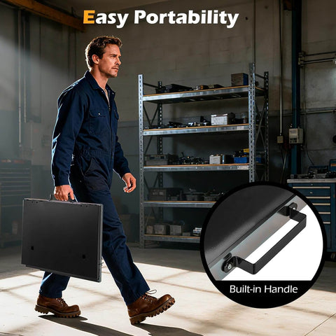 Man carrying Foldable Welding Table Portable 17 By 20 Inches Weld Tabletop with built-in handle in a workshop.