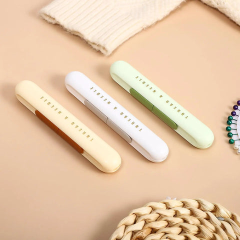 Lightweight ABS Needle Threader And Seam Ripper Tool 3 Piece Set In One Dual Head Design For Quick Threading Stitching And Hand Sewing Tasks Super Handy For Crochet And Craft Fans. three pastel ABS seam ripper and needle threader tools on beige background