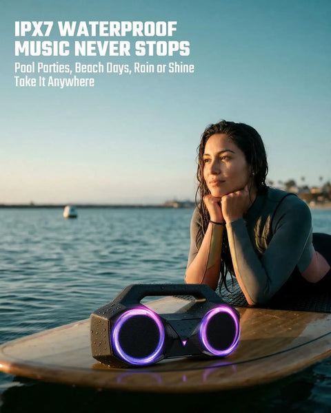 80W Peak Bluetooth Speaker With Bass Boost, Loud As Hell, 20 Hours Of Playtime, IPX7 Waterproof, RGB Lights on surfboard.