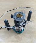 Clear Acrylic Router Base Plate Optimized For Rt0701c And Xtr01z Routers on a compact router, ideal for joinery tasks.