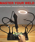 All In One Soldering Station With 5x Magnetic Magnifying Lamp and flexible arms in use for electronics repair on a desk