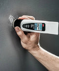 No Sweat Wall Patch Tube, High Strength Spackle With Built-In Applicator Wand, being applied to wall nail hole.
