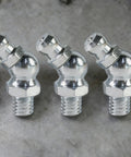10 Piece Metric Grease Fittings Kit With 90 Degree Elbows For Automotive Machinery And Industrial Equipment Pro Grade Heavy Duty Hydraulic Nipples Replacement For Tractors Excavators Trailers And More, displaying multiple metal fittings on a gray background.