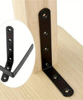 Super Heavy Duty Black Steel L Brackets 20 Pack Rock Solid Corner Reinforcements For Shelves Cabinets And Woodworking Joints 150 Millimeter size demonstrating angled installation.