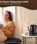Gooseneck Electric Kettle 1L With Six Temperature Presets, 1200W Fast Heating, Auto Shut-Off, Keep-Warm, Stainless Steel Interior And Lid, Matte Black Finish For Pour Over Coffee And Tea on table beside woman with tablet