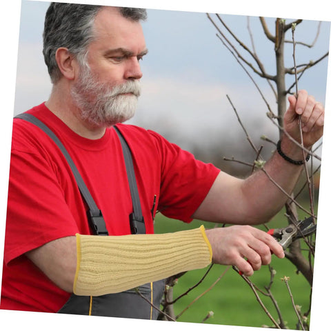 Man wearing Heavy Duty Aramid Arm Guards For Women, Badass Forearm Shields For Gardening And Yard Work, Cut Resistant Sleeves That Shut Out Thorns, Top Notch Outdoor Armor You Gonna Love while pruning branches.