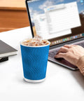 12 Oz Insulated Paper Cups With Ripple Wall For Hot Or Cold Beverages, 50 Count Blue Disposable Cups No Lids on desk with laptop