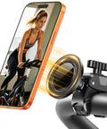 Close-up of Magnetic Gym Phone Holder With Clamp For Treadmills attached to exercise bike with smartphone, demonstrating functionality.