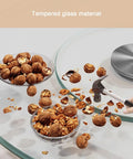 Round Tempered Glass Spin Turntable For Dining Tables With Durable Aluminum Bearing Perfect For Shareable Appetizers Dishes Cakes And Party Spreads At Home Or Restaurant For The Fam shown with nuts and hammer