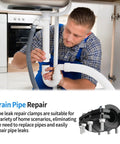 Pipe repair clamp kit installed on white PVC drain pipe under sink; 3/4 inch size.