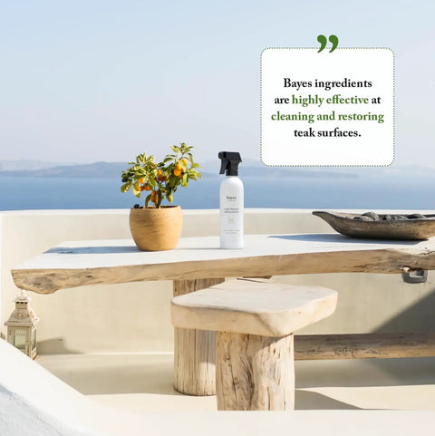 Outdoor table with bottle of Teak Cleaner And Restorer For Fine Teak Wood Keeps It Clean Shiny And Protected Restores Neglected Teak
