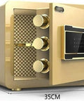 Heavy Duty Home Security Box Safe Built Tough As Nails From Microcarbon Alloy Steel, Water Resistant And Anti Corrosion, Solid Lock Bolts For Maximum Security, Compact Vault For Keys, Jewelry, Cash, Documents, And Small Valuables, opened showing interior and electronic lock, dimensions 25cm by 35cm.