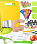 Flat lay of 46-piece kids' kitchen toy set with yellow cutting boards, colorful plastic knives, spoons, peelers, and cutters