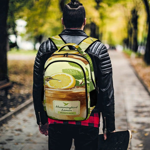 Lemon Americano printed unisex backpack worn outdoors, featuring large capacity and durable polyester fabric with smooth zipper.