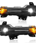 Heavy Duty LED Fog Light Kit For 2017 To 2022 Tesla Model 3 And 2019 To 2024 Model Y Slick Front Bumper Lamps pair showing clear lenses and black housing.
