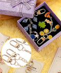 The Real Deal On DIY Keychain Crafting Comes In This Huge Kit Loaded With Iron Clasps Extender Chains Cards And Zip Pouches Plus Ropes To Build Sick Custom Keys Anyone Will Love It Done In Hours Perfect For Rainy Afternoons Or Group Time At Home Now. DIY keychain kit in purple gift box with iron clasps and charms