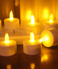Rechargeable Flameless Tealight Candles Set 12 Pack With White Base And USB Charging Dock flickering LED lights on table