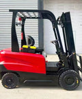 Side view of Heavy Duty Electric Forklift Two Ton With Side Shift Function, showcasing red and black design for warehouse jobs.