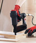 Pro Grade 18 Gauge Pneumatic Brad Nailer And Air Powered 2 In 1 Staple Gun Kit in use on wood, demonstrating sturdy build and smooth firing action.