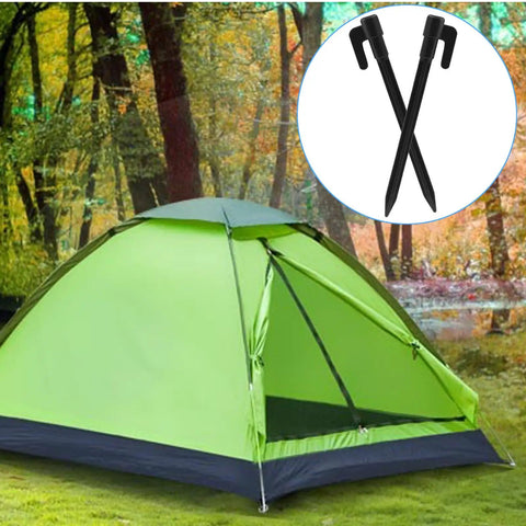 Green tent on grass with inset image of two black plastic stakes, 24 Pack 5.7 Inch Plastic Tent Stakes For Tents And Canopies.