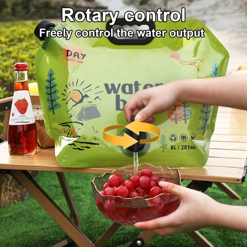 All Day Hydration On Tap Large Capacity Camping Water Container dispensing water into a bowl of red grapes on a table.