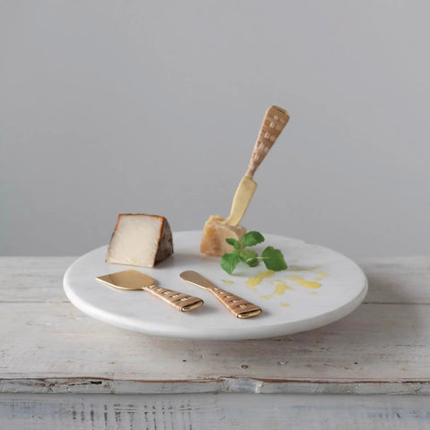 Top Shelf Smooth Spin White Marble Lazy Susan 14 Inch Rolling Turntable with cheese, garnishes, and utensils for serving.